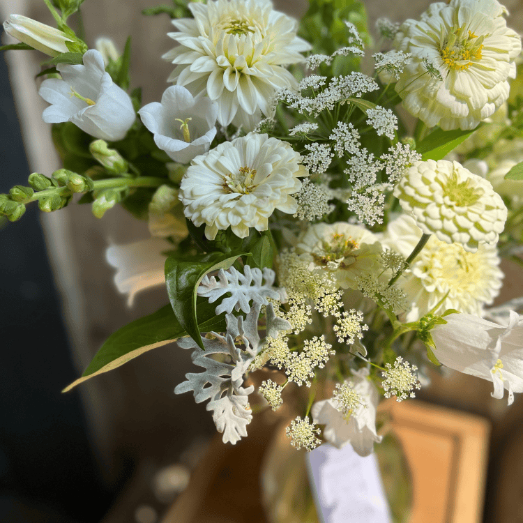 all white floral delivery for sympathy